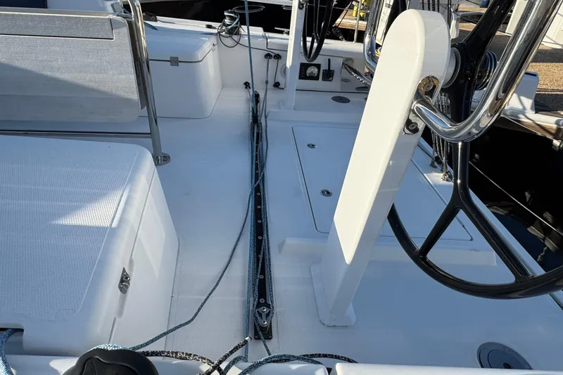  Yacht Photos Pics 2023 Beneteau First 36 yacht cockpit with dual steering wheels and sleek design.