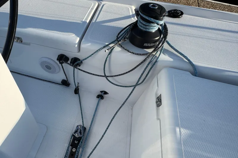  Yacht Photos Pics Close-up of 2023 Beneteau First 36 sailboat deck with winch and ropes.