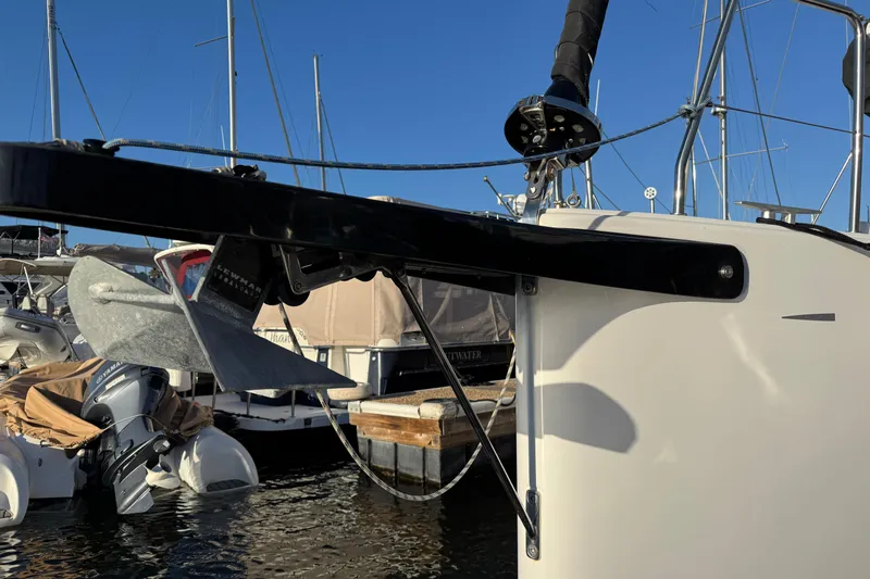  Yacht Photos Pics 2023 Beneteau First 36 sailboat anchor detail at marina, clear blue sky.