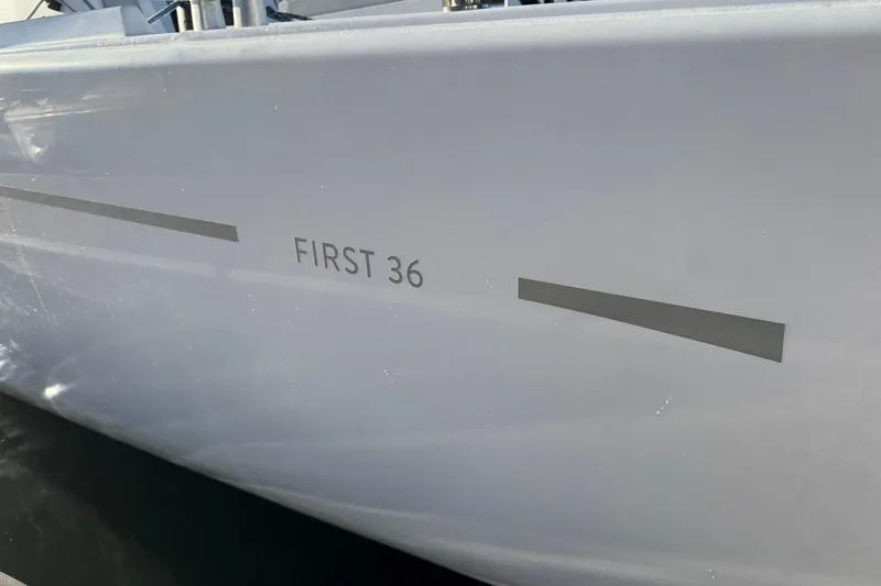  Yacht Photos Pics 2023 Beneteau First 36 sailboat hull with model name visible.