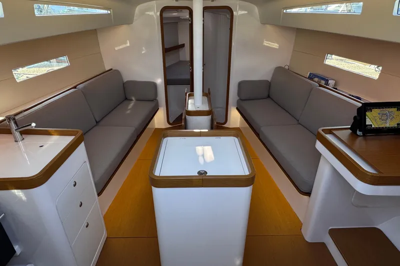  Yacht Photos Pics Interior of 2023 Beneteau First 36 sailboat, featuring modern design and comfortable seating.