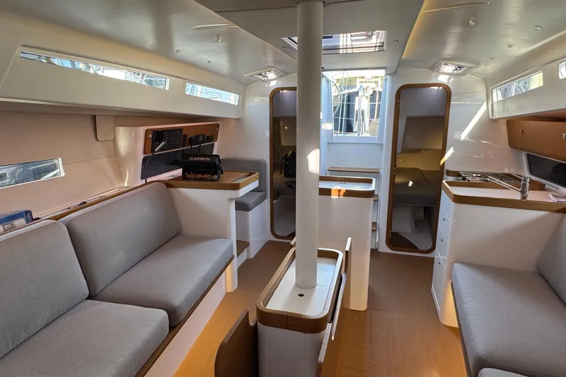  Yacht Photos Pics Interior of 2023 Beneteau First 36 sailboat, featuring modern design and comfortable seating.