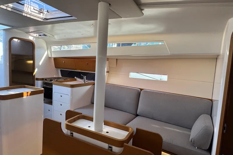  Yacht Photos Pics Modern interior of 2023 Beneteau First 36 yacht with sleek kitchen and comfortable seating.
