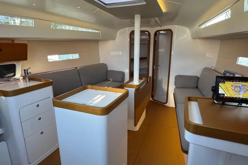  Yacht Photos Pics Interior of 2023 Beneteau First 36 sailboat, featuring modern design and comfortable seating.