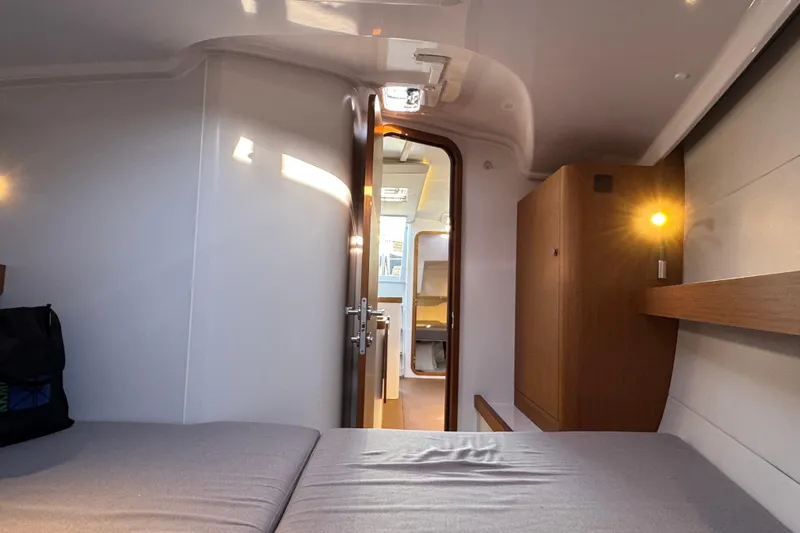  Yacht Photos Pics 2023 Beneteau First 36 interior cabin with modern design and cozy lighting.