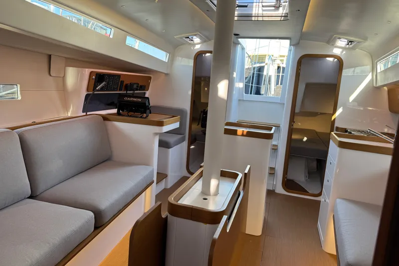  Yacht Photos Pics Interior of 2023 Beneteau First 36 sailboat, featuring modern design and comfortable seating.