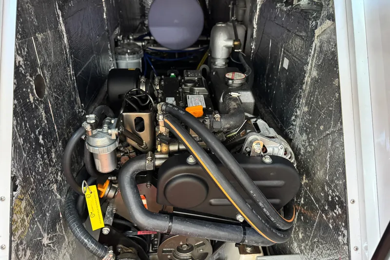  Yacht Photos Pics Engine compartment of 2023 Beneteau First 36 sailboat, showcasing detailed mechanical components.