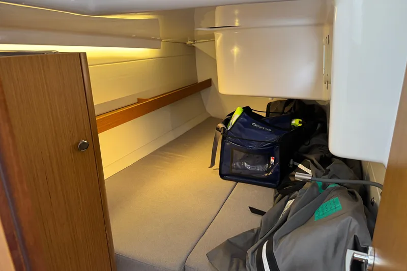  Yacht Photos Pics 2023 Beneteau First 36 cabin interior with storage and gear bags.