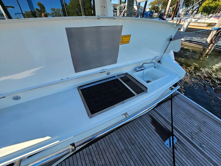 Margie Yacht Photos Pics 2018 Prestige 460 yacht with outdoor kitchen and sink at dock.