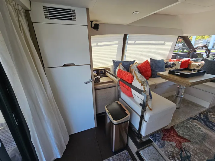 Margie Yacht Photos Pics Interior of a 2018 Prestige 460 yacht, modern design, cozy seating area.