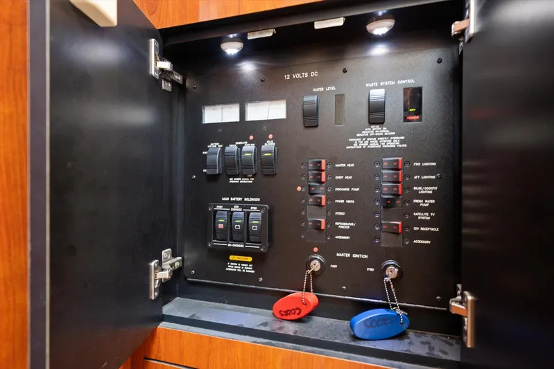 Free Bird Yacht Photos Pics Electrical control panel inside 2003 Sea Ray 480 Motor Yacht, featuring switches and indicators.