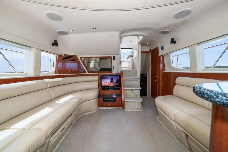 Free Bird Yacht Photos Pics Luxurious interior of 2003 Sea Ray 480 Motor Yacht with plush seating and modern amenities.