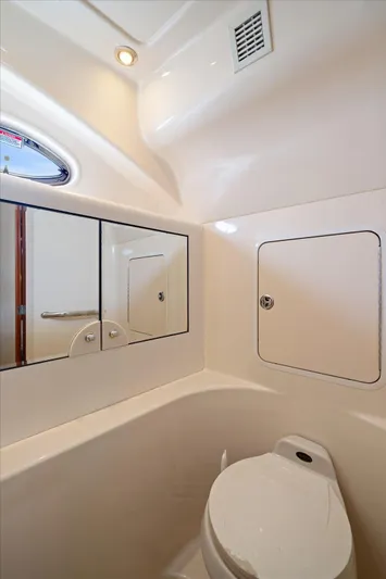 Free Bird Yacht Photos Pics Bathroom interior of 2003 Sea Ray 480 Motor Yacht with mirror and toilet.