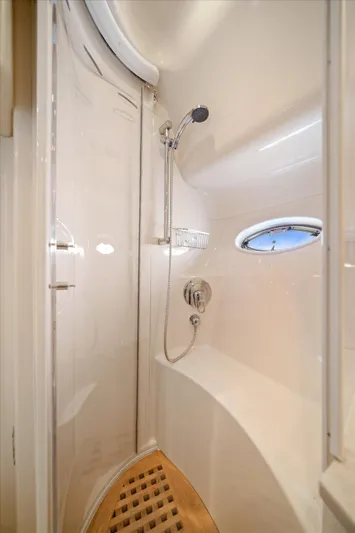 Free Bird Yacht Photos Pics Shower area in 2003 Sea Ray 480 Motor Yacht with sleek design and porthole window.