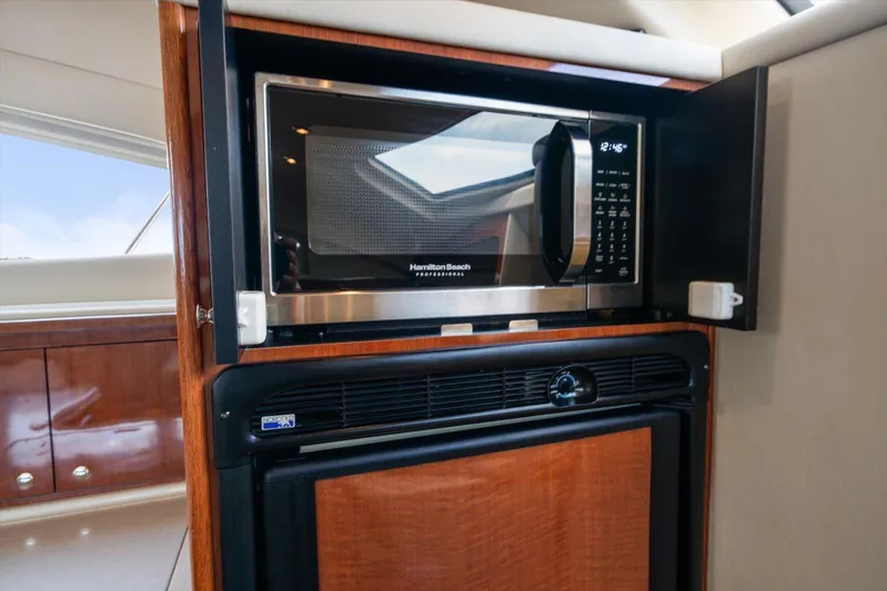 Free Bird Yacht Photos Pics Microwave and fridge in 2003 Sea Ray 480 Motor Yacht kitchen area.