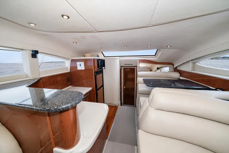 Free Bird Yacht Photos Pics Luxurious interior of 2003 Sea Ray 480 Motor Yacht with elegant seating and modern amenities.