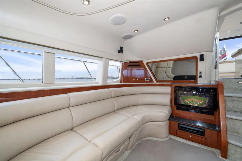 Free Bird Yacht Photos Pics Luxurious interior of 2003 Sea Ray 480 Motor Yacht with leather seating and TV.