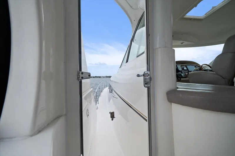 Free Bird Yacht Photos Pics 2003 Sea Ray 480 Motor Yacht interior view with open door, overlooking water.