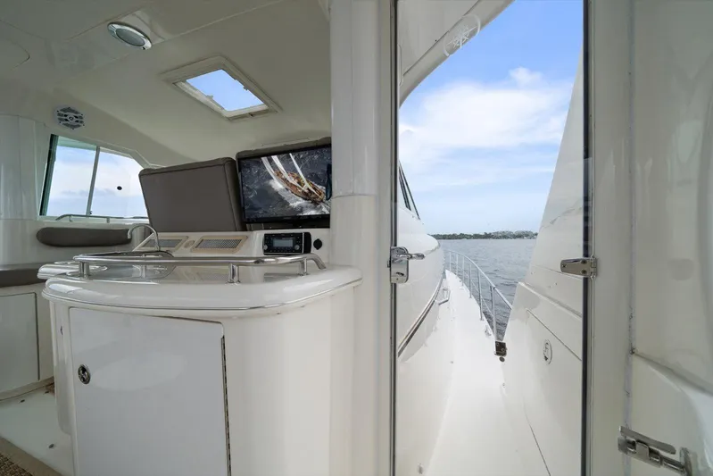 Free Bird Yacht Photos Pics 2003 Sea Ray 480 Motor Yacht interior with open door, showcasing water view.