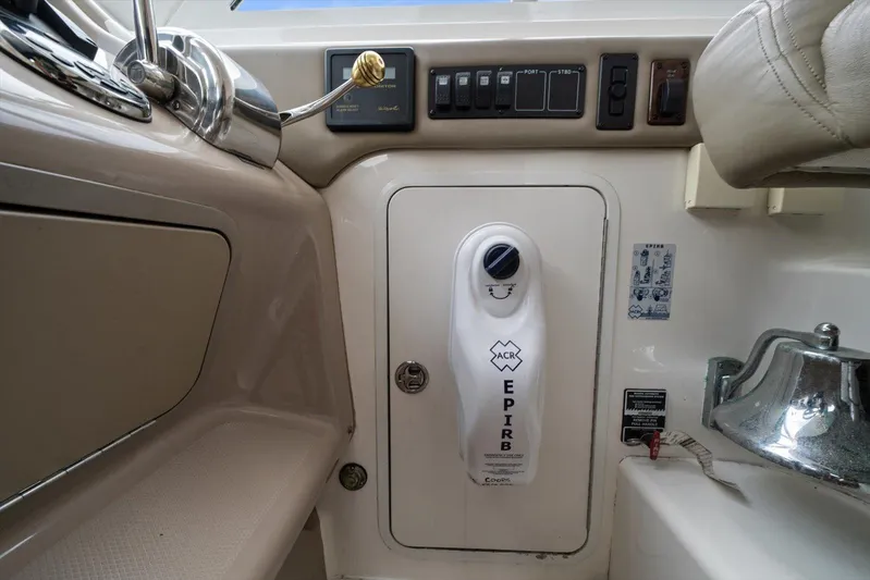 Free Bird Yacht Photos Pics Control panel and EPIRB on 2003 Sea Ray 480 Motor Yacht dashboard.