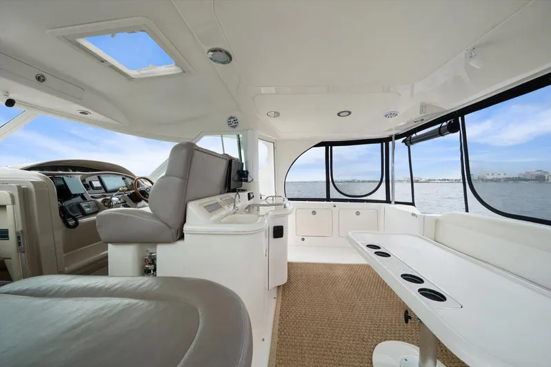 Free Bird Yacht Photos Pics 2003 Sea Ray 480 Motor Yacht interior with helm, seating, and ocean view.
