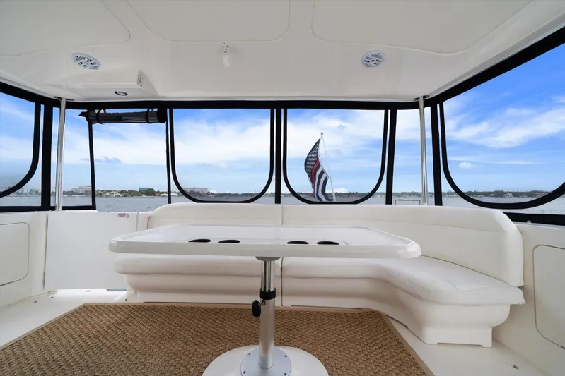 Free Bird Yacht Photos Pics Luxurious interior of 2003 Sea Ray 480 Motor Yacht with panoramic windows and seating.