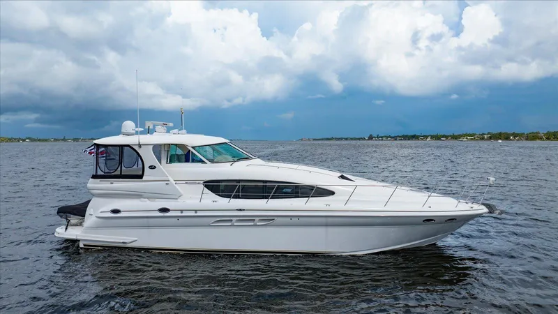 Free Bird Yacht Photos Pics 2003 Sea Ray 480 Motor Yacht on open water under cloudy sky.