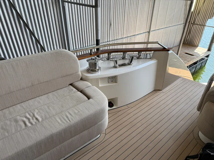 Rebellion Yacht Photos Pics Luxurious seating area on a 2012 Monte Carlo Yachts 76, featuring elegant design and craftsmanship.
