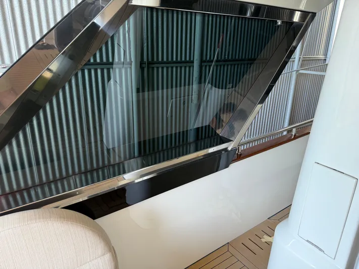 Rebellion Yacht Photos Pics 2012 Monte Carlo Yachts 76 interior with sleek window design and modern finishes.