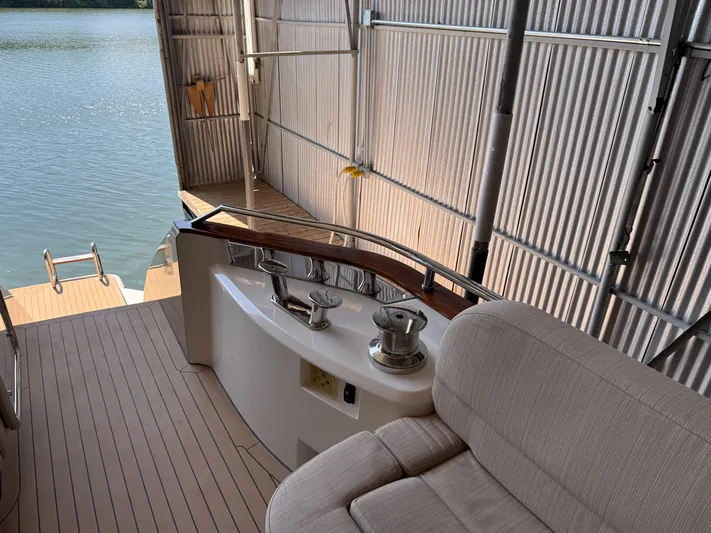 Rebellion Yacht Photos Pics Luxury Monte Carlo Yachts 76, 2012 model, docked with elegant seating and water view.