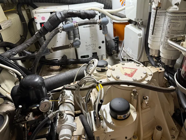 Rebellion Yacht Photos Pics Engine room of a 2012 Monte Carlo Yachts 76, showcasing mechanical components and systems.
