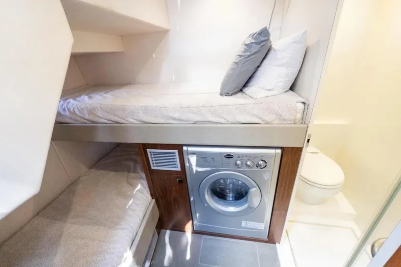  Yacht Photos Pics 2020 Sunseeker Predator 74 yacht cabin with bunk beds, washing machine, and bathroom.