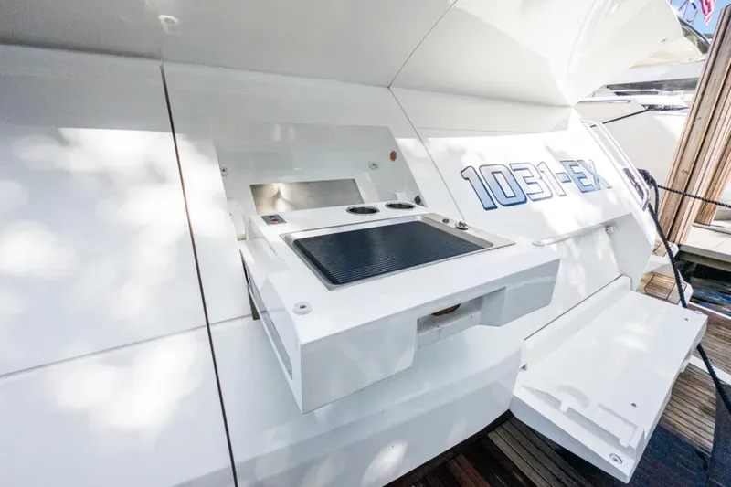  Yacht Photos Pics 2020 Sunseeker Predator 74 yacht with outdoor grill and sleek design.