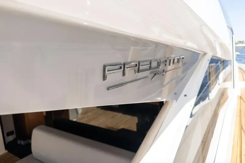  Yacht Photos Pics 2020 Sunseeker Predator 74 yacht, sleek design with metallic logo detail.
