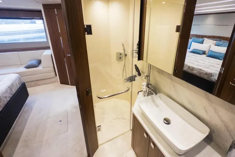  Yacht Photos Pics Luxurious bathroom interior on 2020 Sunseeker Predator 74 yacht, featuring modern design and amenities.