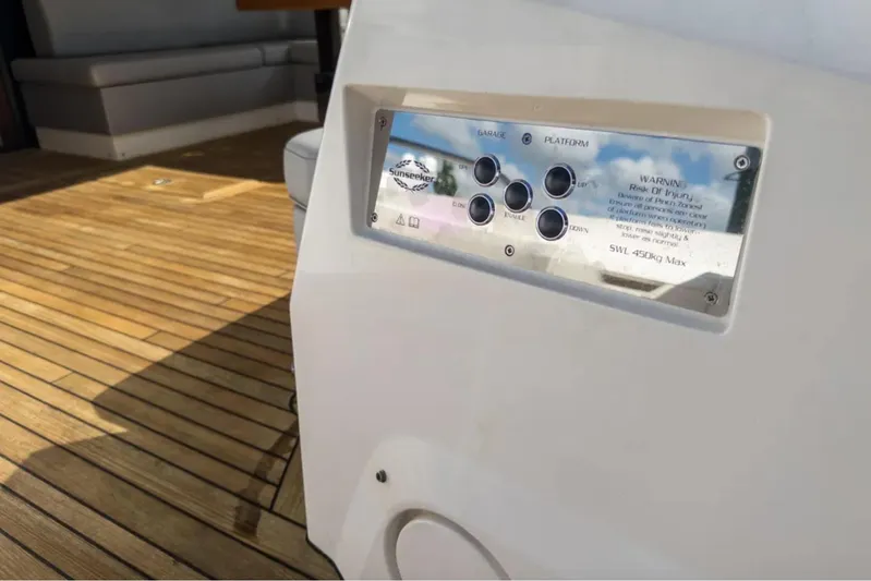  Yacht Photos Pics Control panel on 2020 Sunseeker Predator 74 yacht with wooden deck background.