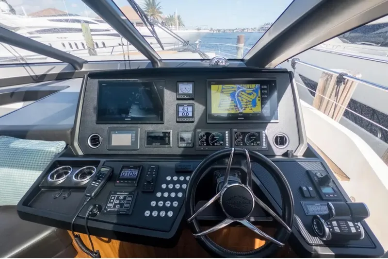  Yacht Photos Pics Helm of 2020 Sunseeker Predator 74 yacht with advanced navigation controls and displays.