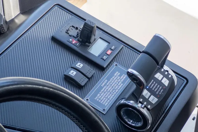  Yacht Photos Pics Control panel of 2020 Sunseeker Predator 74 yacht with throttle and switches.