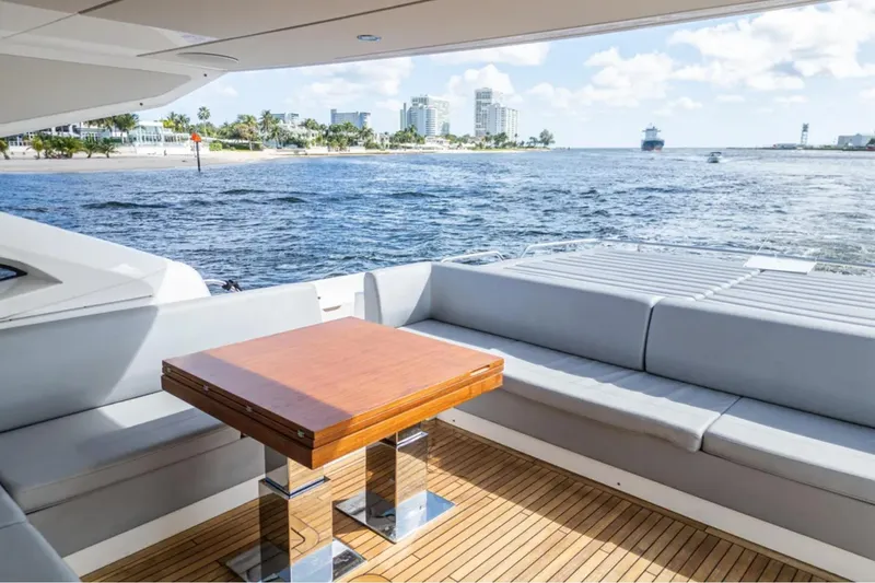  Yacht Photos Pics Luxury Sunseeker Predator 74 yacht interior with ocean view, featuring sleek seating and wooden table.