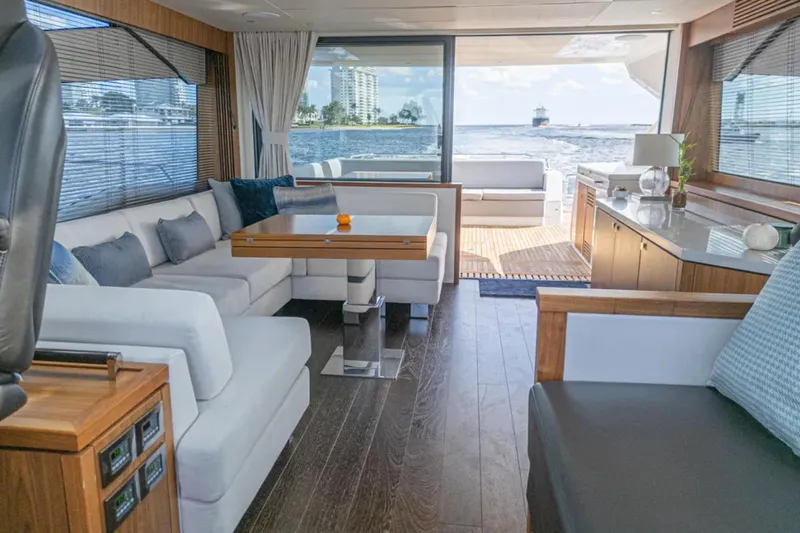  Yacht Photos Pics Luxurious interior of 2020 Sunseeker Predator 74 yacht with elegant seating and ocean view.