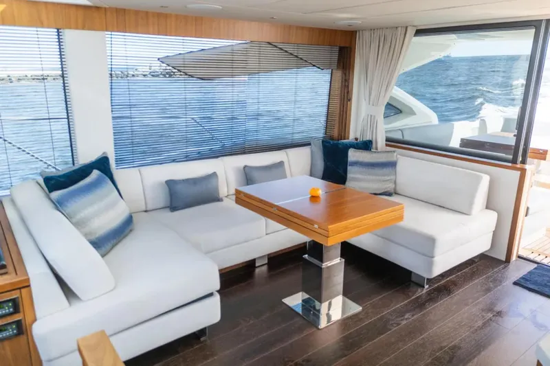  Yacht Photos Pics Luxurious interior of 2020 Sunseeker Predator 74 yacht with elegant seating and ocean view.