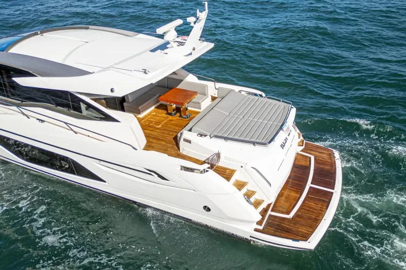  Yacht Photos Pics Luxury Sunseeker Predator 74 yacht cruising on open water, 2020 model.