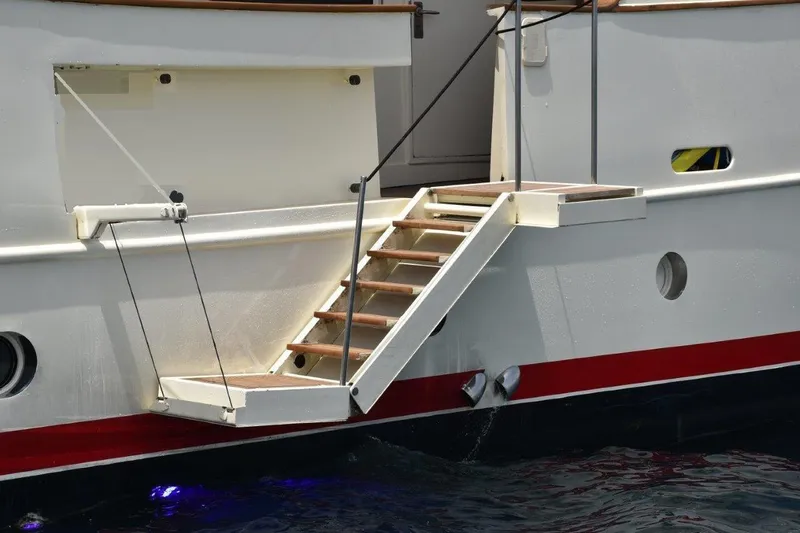  Yacht Photos Pics Staircase on 2005 Benetti Style Explorer 34m yacht, docked with visible hull details.