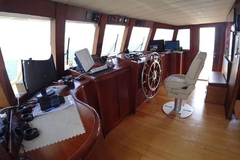  Yacht Photos Pics Pilothouse of 2005 Benetti Style Explorer 34m yacht with navigation equipment and captain's chair.