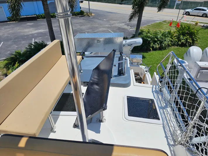  Yacht Photos Pics 2014 Ranger Tugs 31-CB boat deck with seating, netting, and equipment under sunny skies.