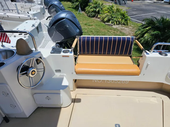  Yacht Photos Pics 2014 Ranger Tugs 31-CB boat interior with steering wheel, seating, and Yamaha engines.