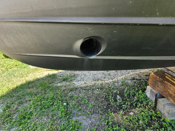  Yacht Photos Pics Close-up of a 2014 Ranger Tugs 31-CB hull with a drainage hole.