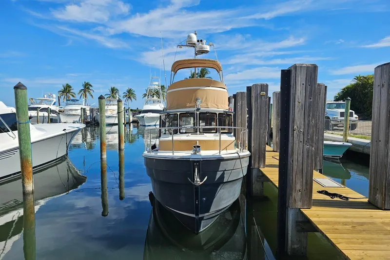  Yacht Photos Pics 2014 Ranger Tugs R 31 docked at marina with clear blue sky.