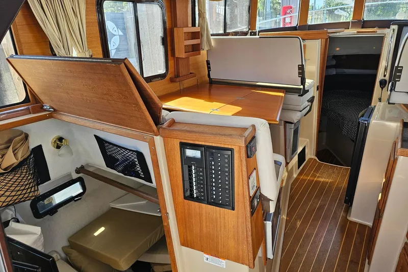  Yacht Photos Pics 2014 Ranger Tugs R 31 interior with wood accents and seating area.