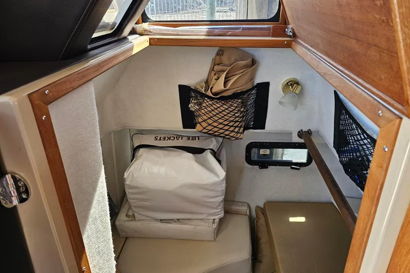  Yacht Photos Pics 2014 Ranger Tugs R 31 cabin interior with life jackets and storage nets.